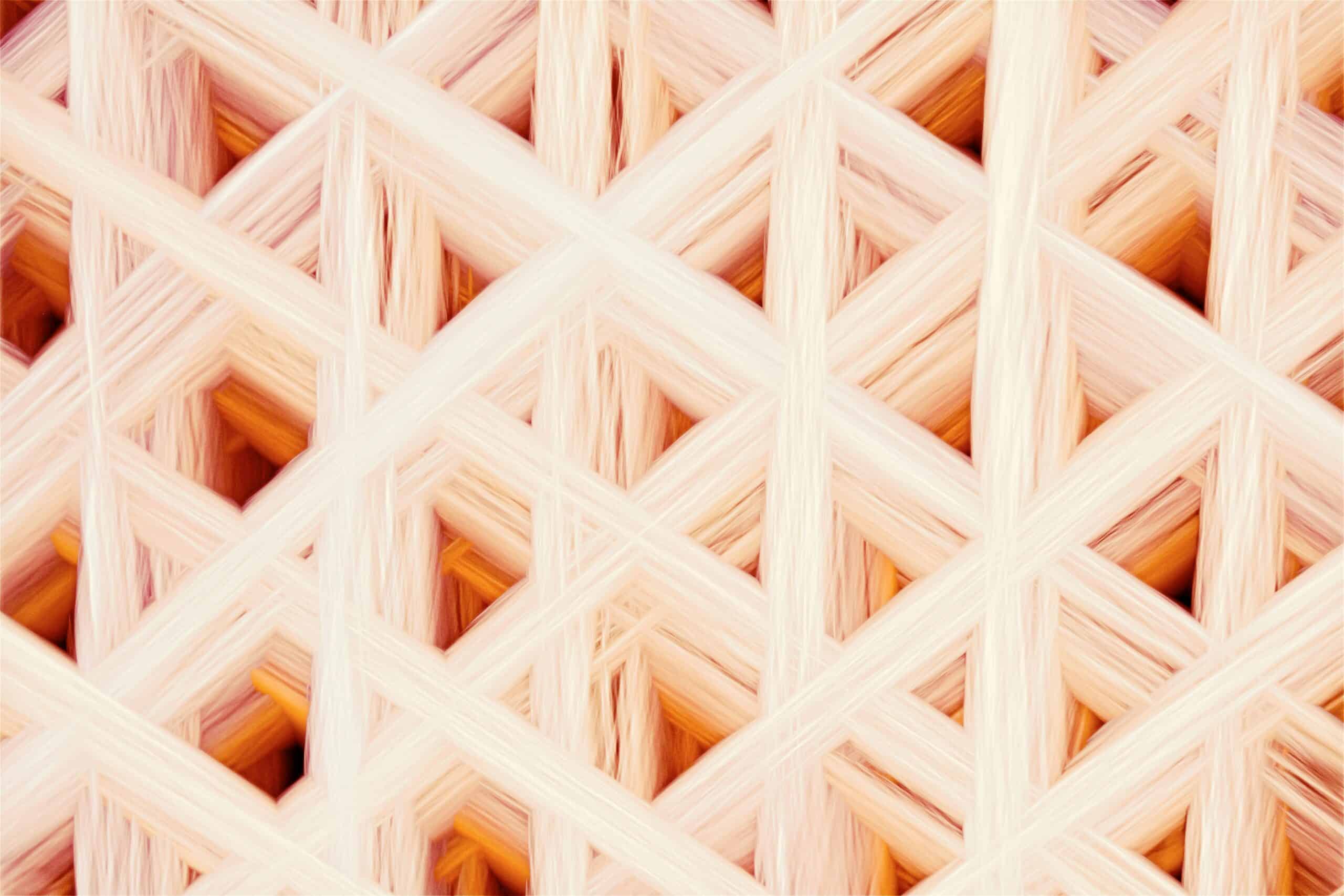 Detailed abstract geometric pattern with a warm-toned woven texture, perfect for modern design projects.